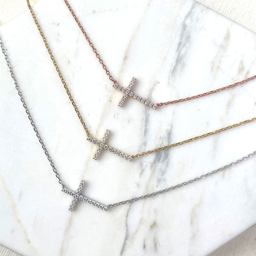 Flatlay view of Sideways Cross CZ Necklace in Sterling Silver, 9 of 10