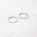 Flatlay view of Bar CZ Medium Hoop Earrings in Sterling Silver, 1 inch