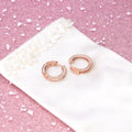 Flatlay view of Bar CZ Medium Inside-Out Hoop Earrings in Sterling Silver 0.75 inch, Rose Gold Flashed