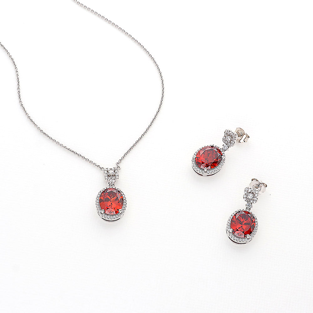 Flatlay view of Halo Clover Oval CZ Necklace in Sterling Silver, Red Color