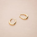 Flatlay view of Oval Medium Hoop Earrings 0.9 inch, Silver-Tone