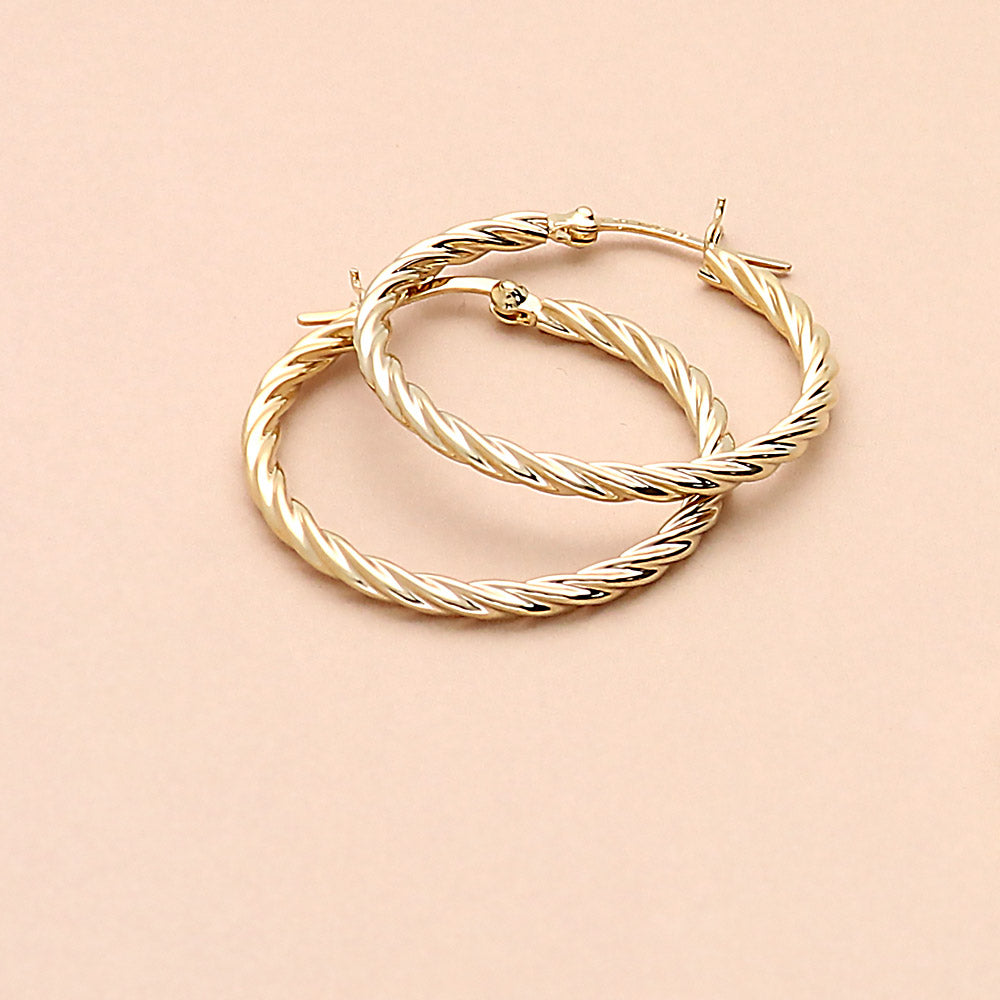 Flatlay view of Cable Medium Hoop Earrings in Sterling Silver 1.2 inch, 7 of 10