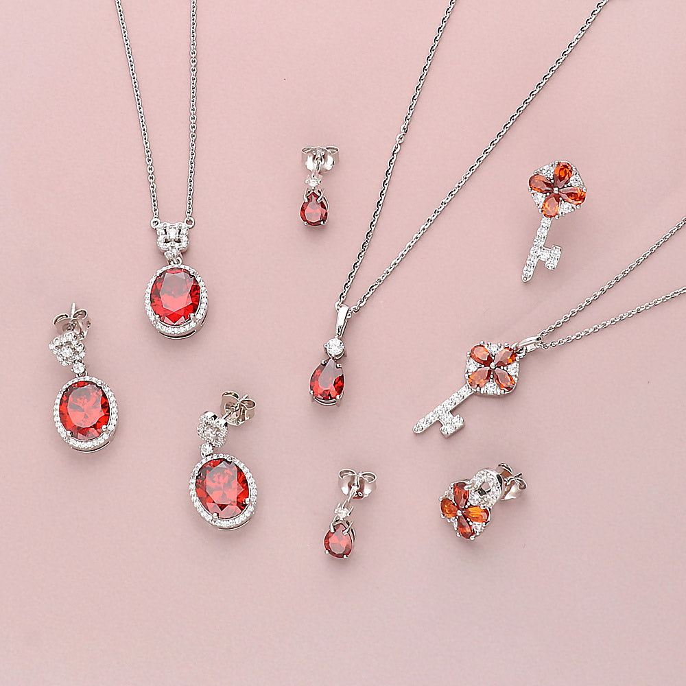 Flatlay view of Halo Clover Oval CZ Set in Sterling Silver, Red Color