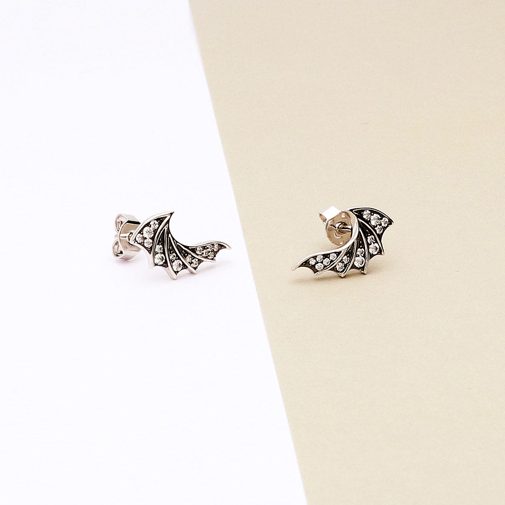 Flatlay view of Angel Wings CZ Stud Earrings in Sterling Silver, 2 of 5