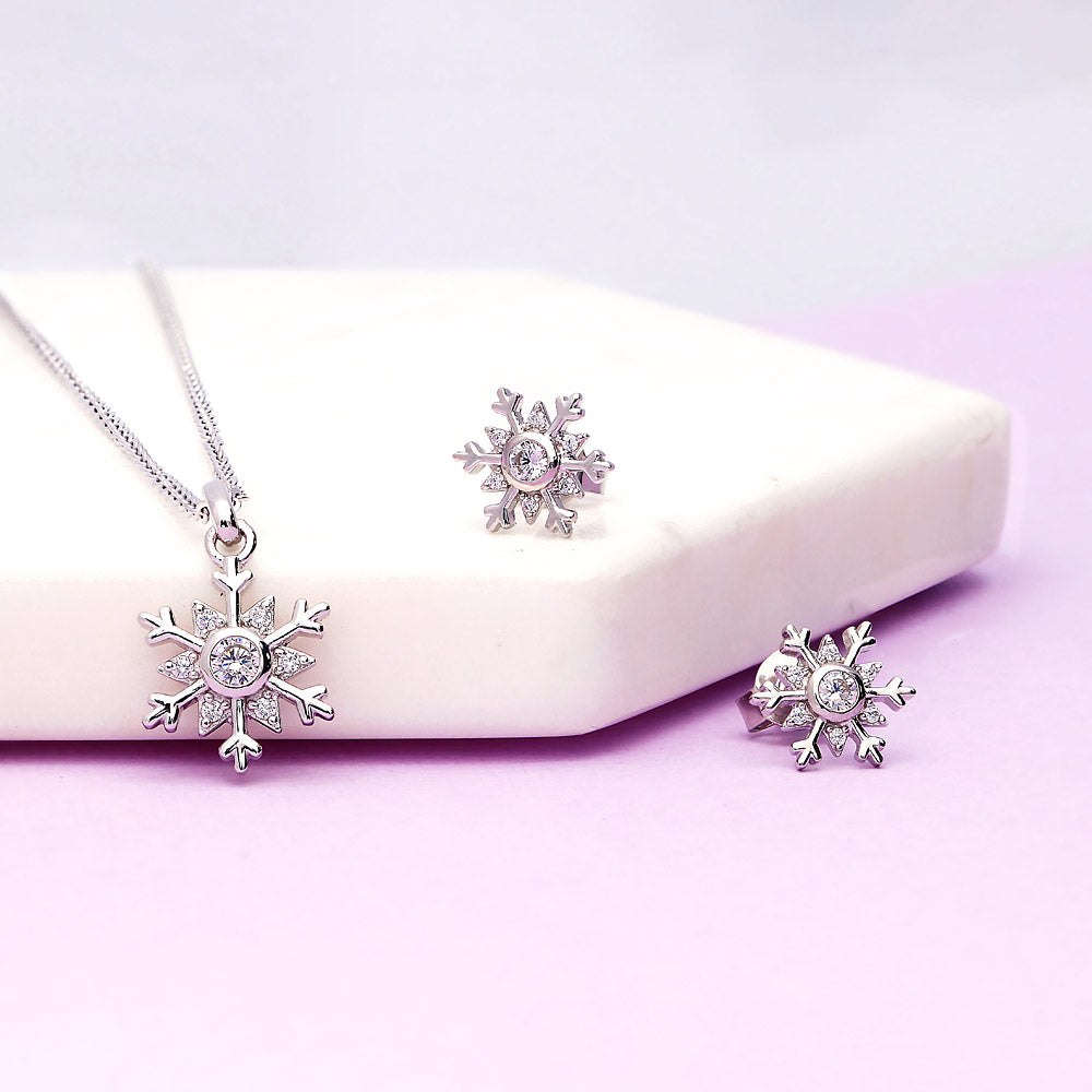 Flatlay view of Snowflake CZ Necklace and Earrings in Sterling Silver, 2 of 8