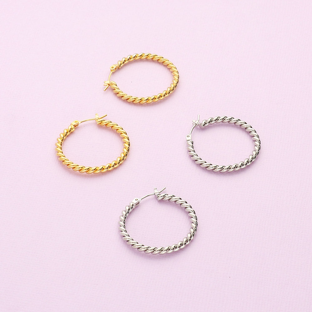 Flatlay view of Cable Medium Hoop Earrings 1.1 inch