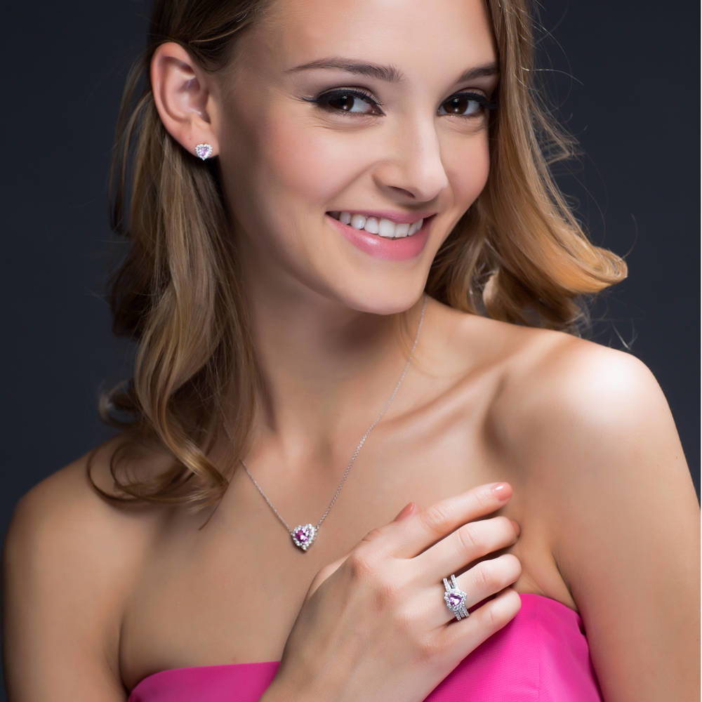 Model wearing Halo Heart Heart CZ Stud Earrings in Sterling Silver, 9 of 20