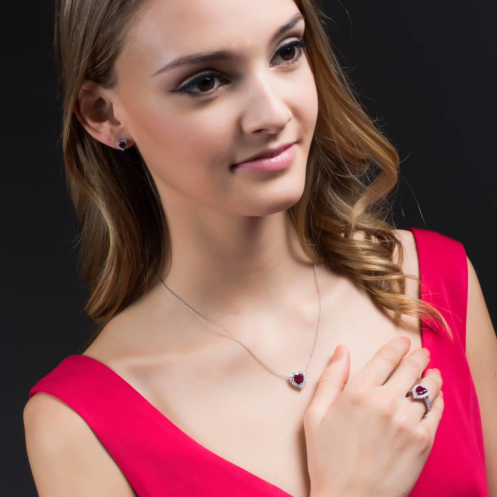 Model wearing Halo Heart Heart CZ Stud Earrings in Sterling Silver, 14 of 20