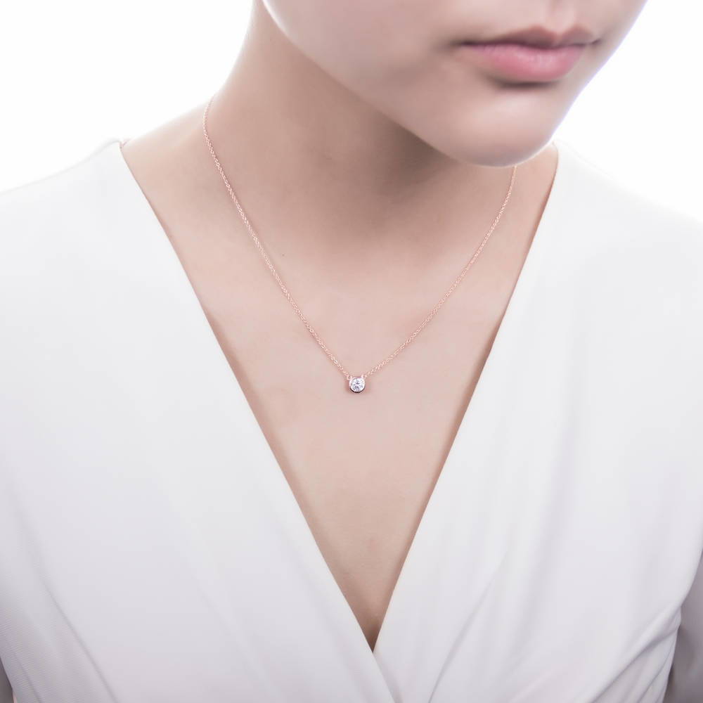 Model wearing Solitaire 0.45ct Bezel CZ Mini Necklace in Sterling Silver, Rose Gold Flashed