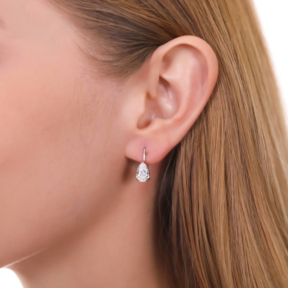 Model wearing Solitaire Pear CZ Leverback Earrings in Sterling Silver, 7 of 12