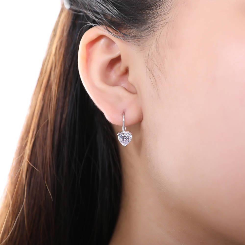 Model wearing Solitaire Heart Heart CZ Leverback Earrings in Sterling Silver, 4 of 7