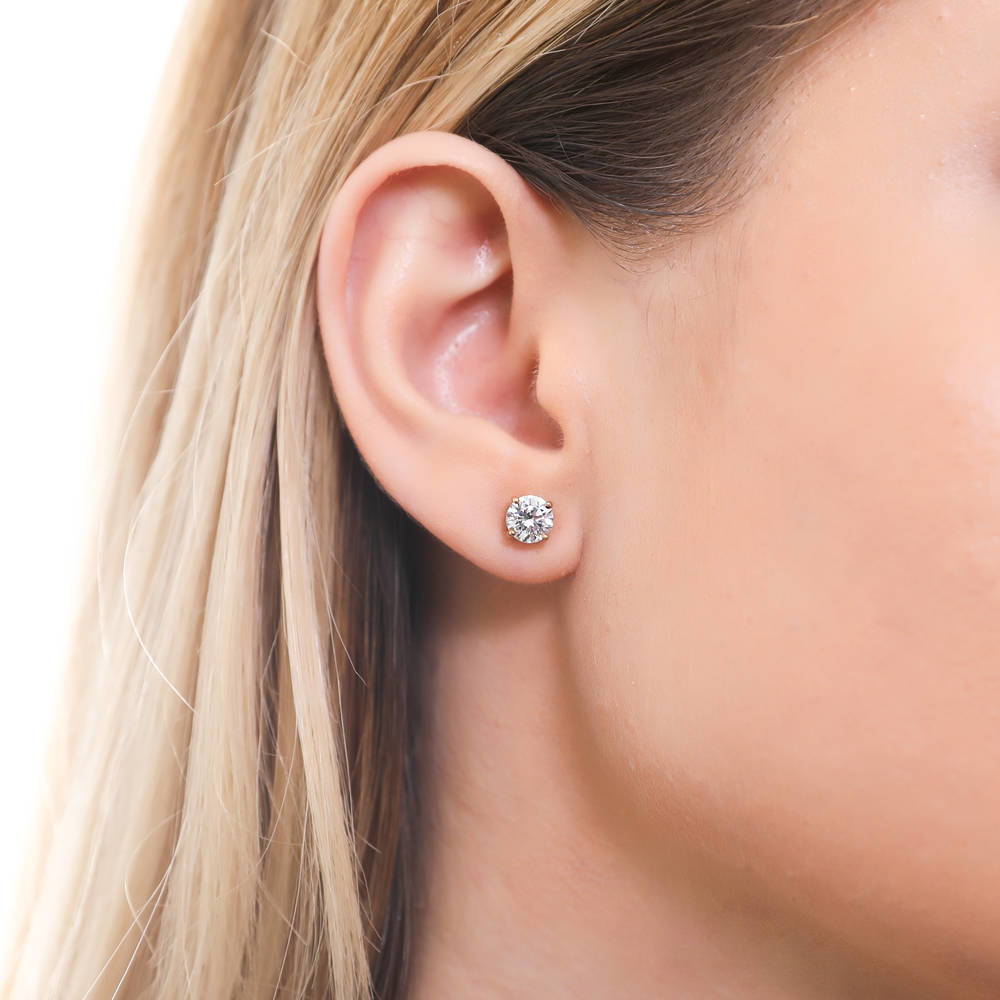 Model wearing Solitaire 1.6ct CZ Stud Earrings in Sterling Silver, 2 of 18