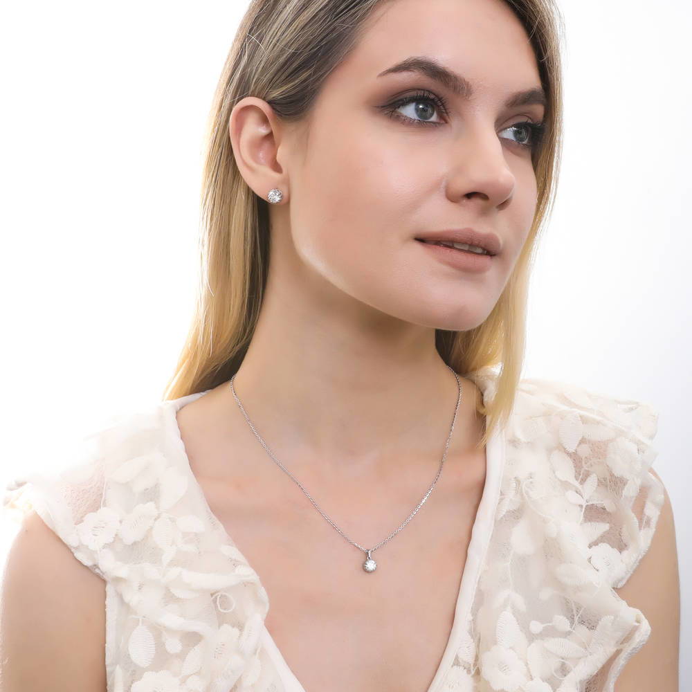 Model wearing Graduated Solitaire Crown Set CZ Set in Sterling Silver, 13 of 14