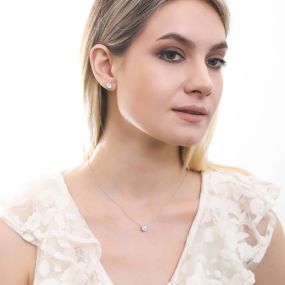 Model wearing Solitaire 1.6ct CZ Stud Earrings in Sterling Silver, 13 of 17