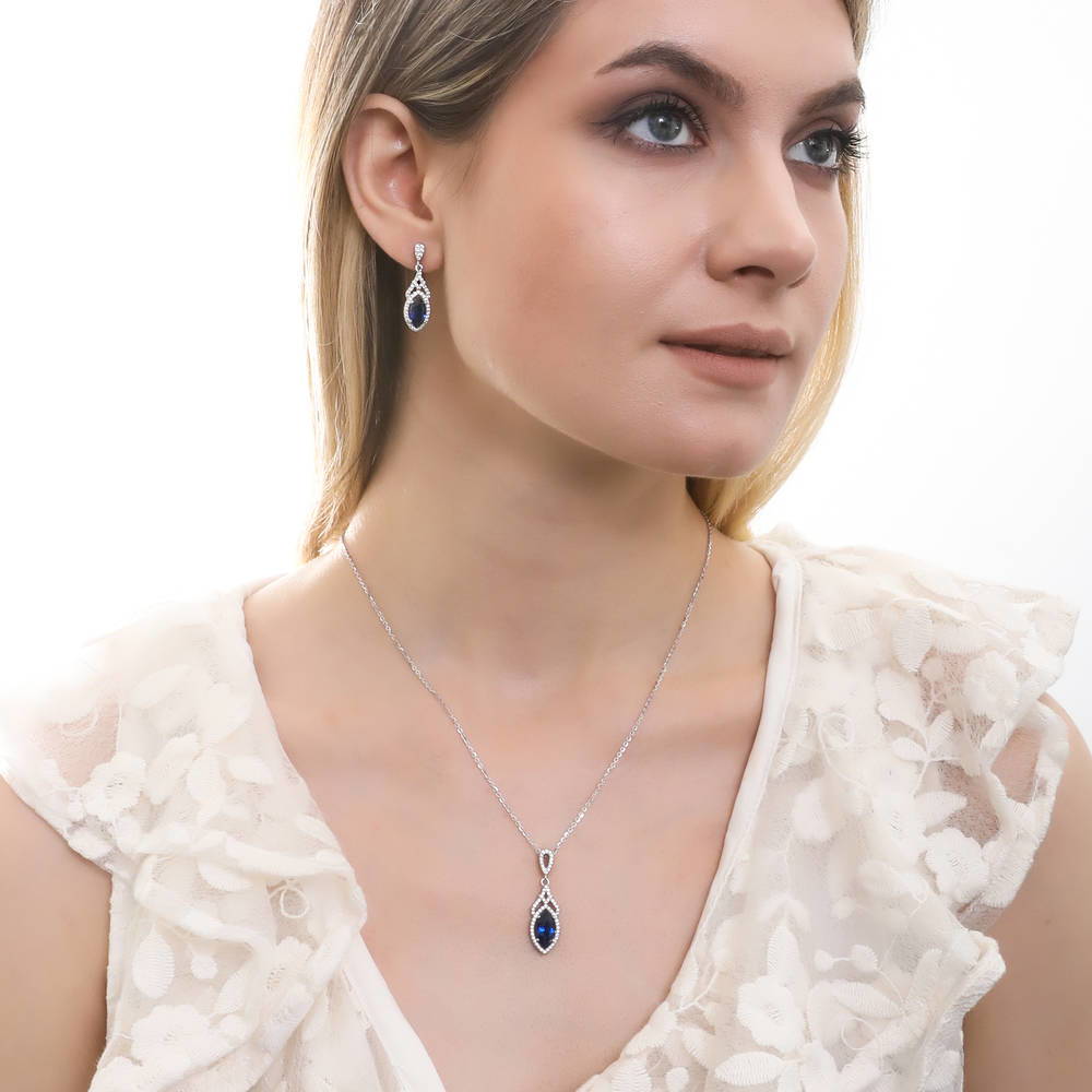 Model wearing Halo Art Deco Marquise CZ Earrings in Sterling Silver, 6 of 7