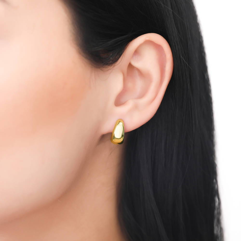 Model wearing Dome Small Huggie Earrings in Sterling Silver 0.55 inch, 9 of 18