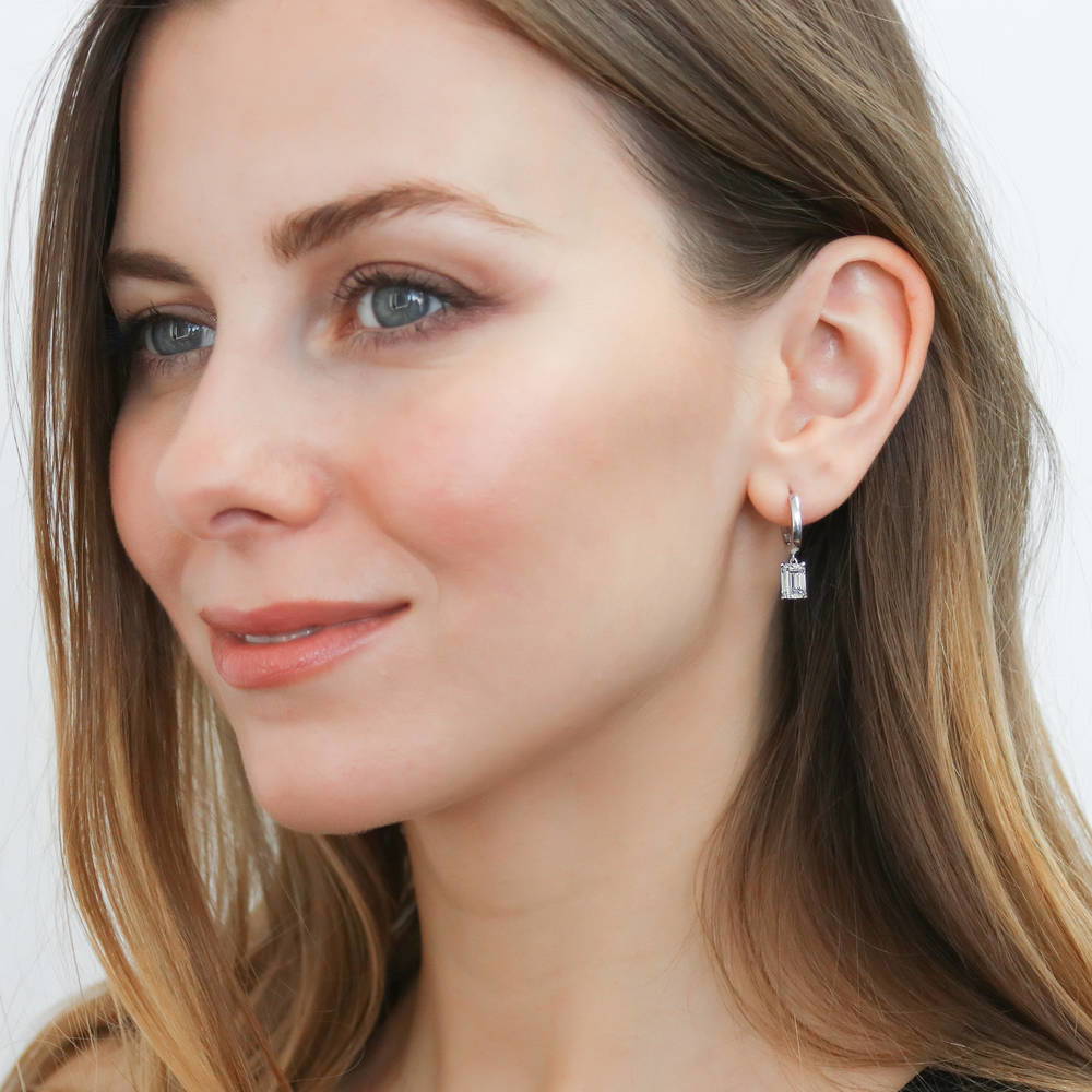 Model wearing Solitaire CZ Huggie Earrings in Sterling Silver 0.5 inch, 12 of 14