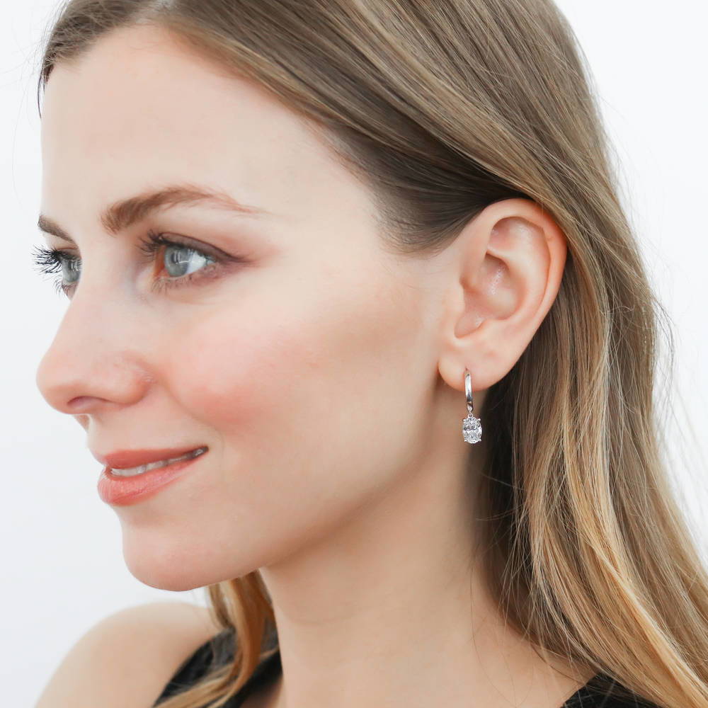 Model wearing Solitaire CZ Huggie Earrings in Sterling Silver 0.5 inch, 11 of 20