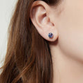 Model wearing Solitaire Kaleidoscope CZ Stud Earrings in Sterling Silver 2.5ct, Purple Aqua Color