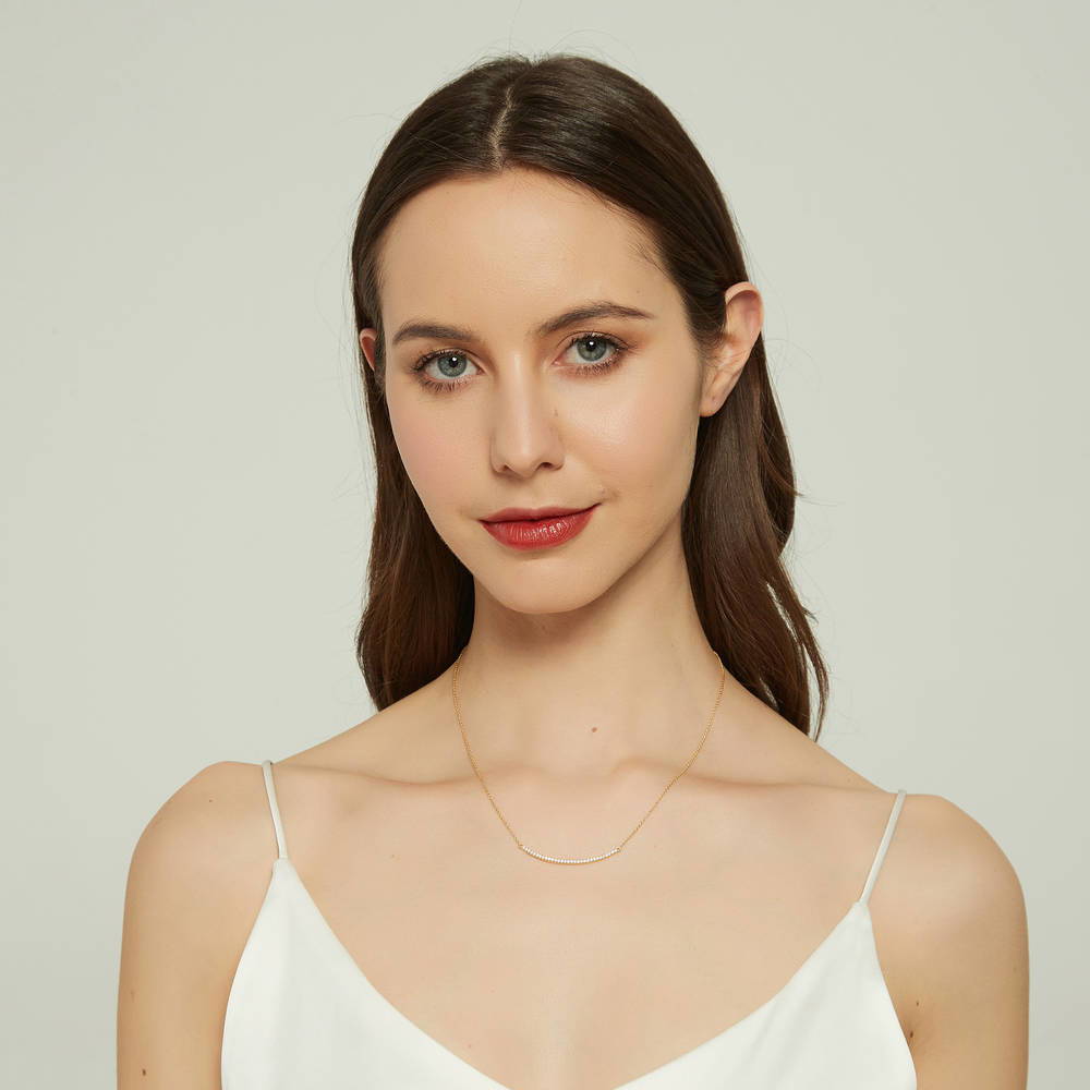 Model wearing Bar CZ Pendant Necklace in Sterling Silver, Yellow Gold Flashed