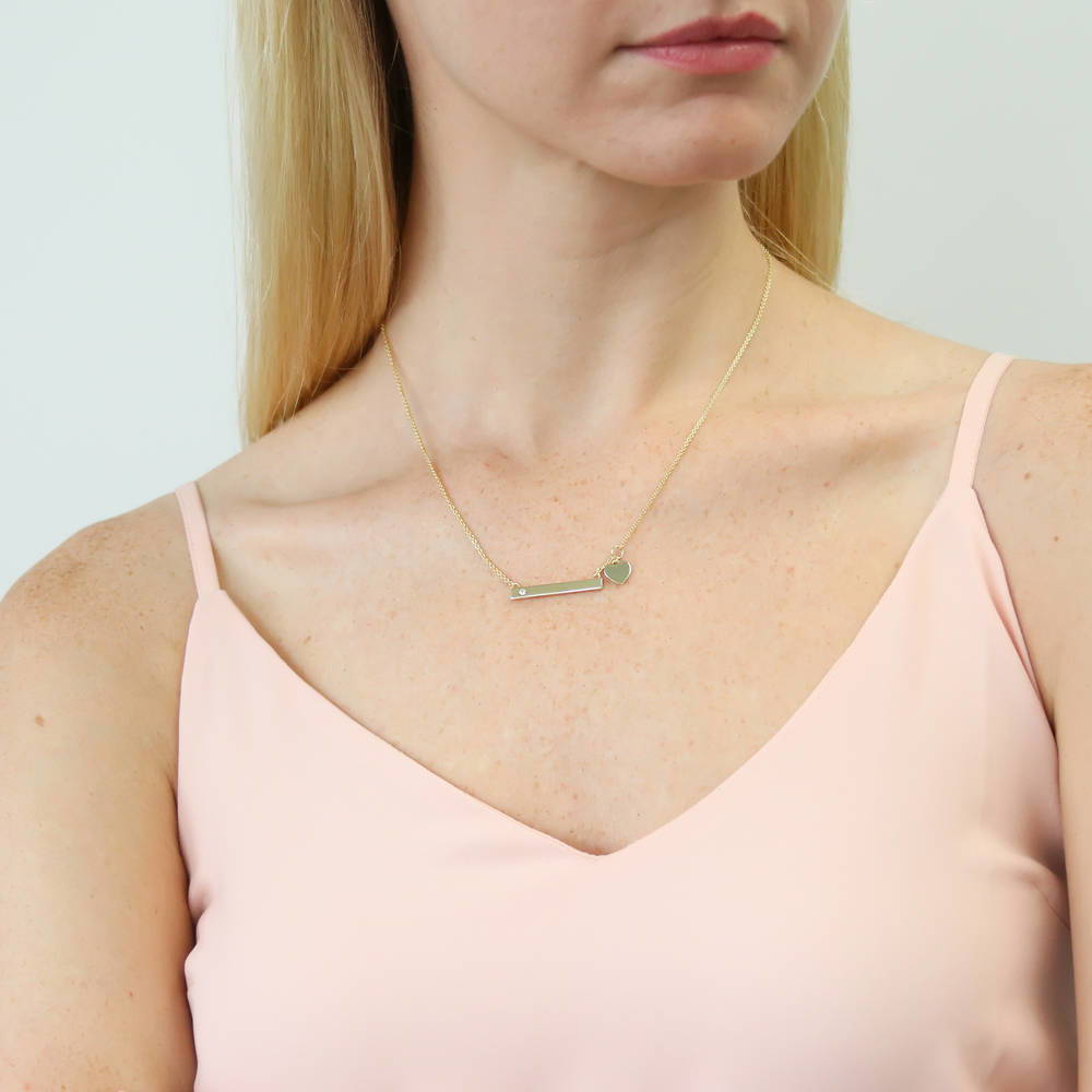 Model wearing Bar Heart CZ Necklace in Sterling Silver, 2 of 10