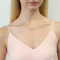 Model wearing Bubble Graduated CZ Necklace in Sterling Silver, Yellow Gold Flashed