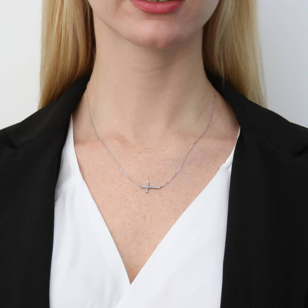 Model wearing Sideways Cross CZ Necklace in Sterling Silver, 8 of 10