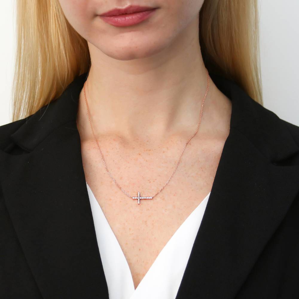 Model wearing Sideways Cross CZ Necklace in Sterling Silver, 2 of 10