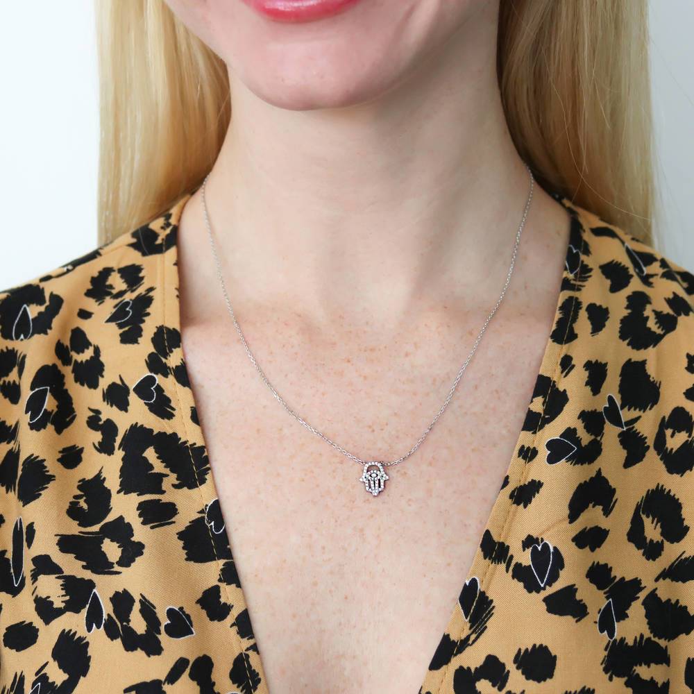 Model wearing Hamsa Hand Evil Eye CZ Necklace in Sterling Silver, 8 of 9