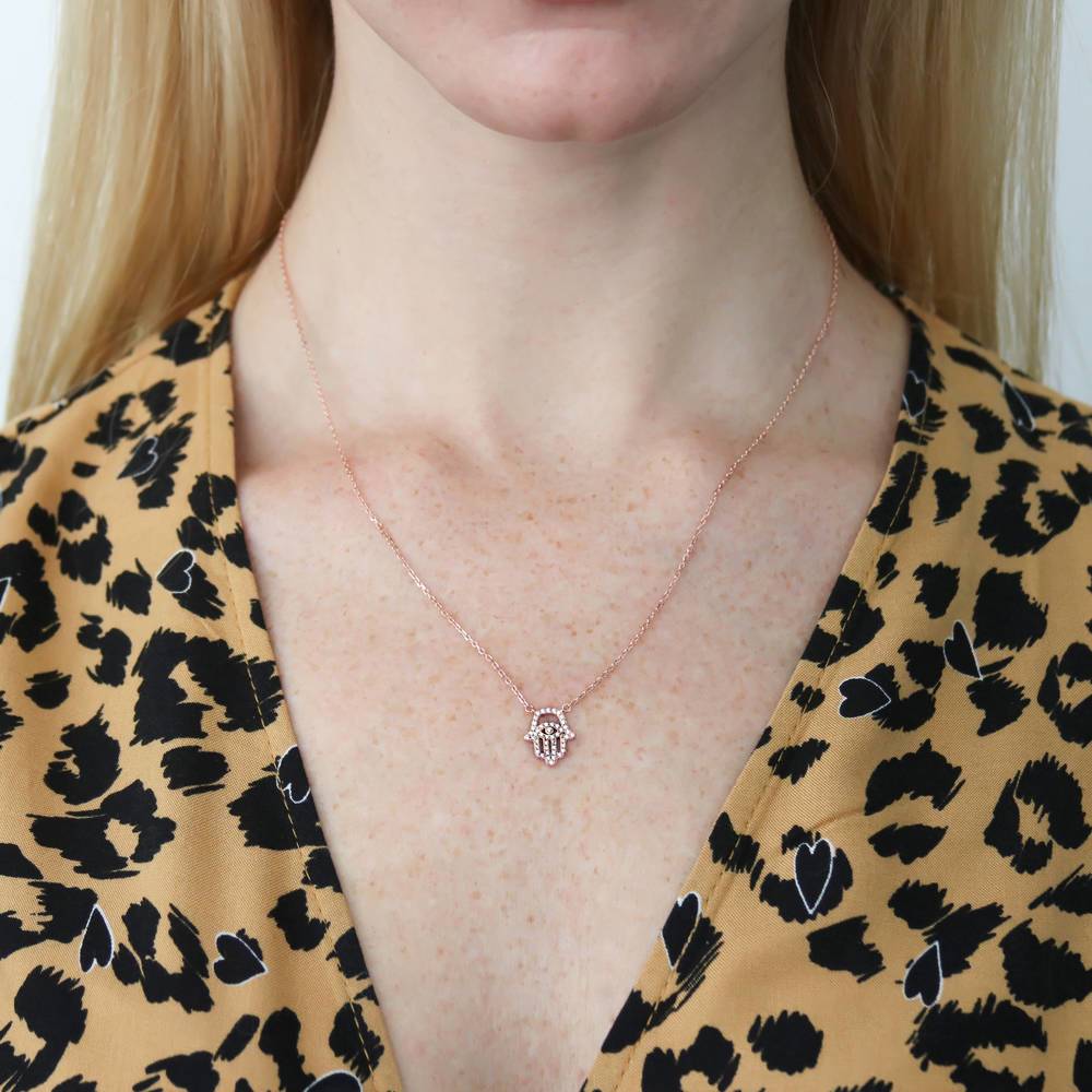 Model wearing Hamsa Hand Evil Eye CZ Necklace in Sterling Silver, 2 of 9