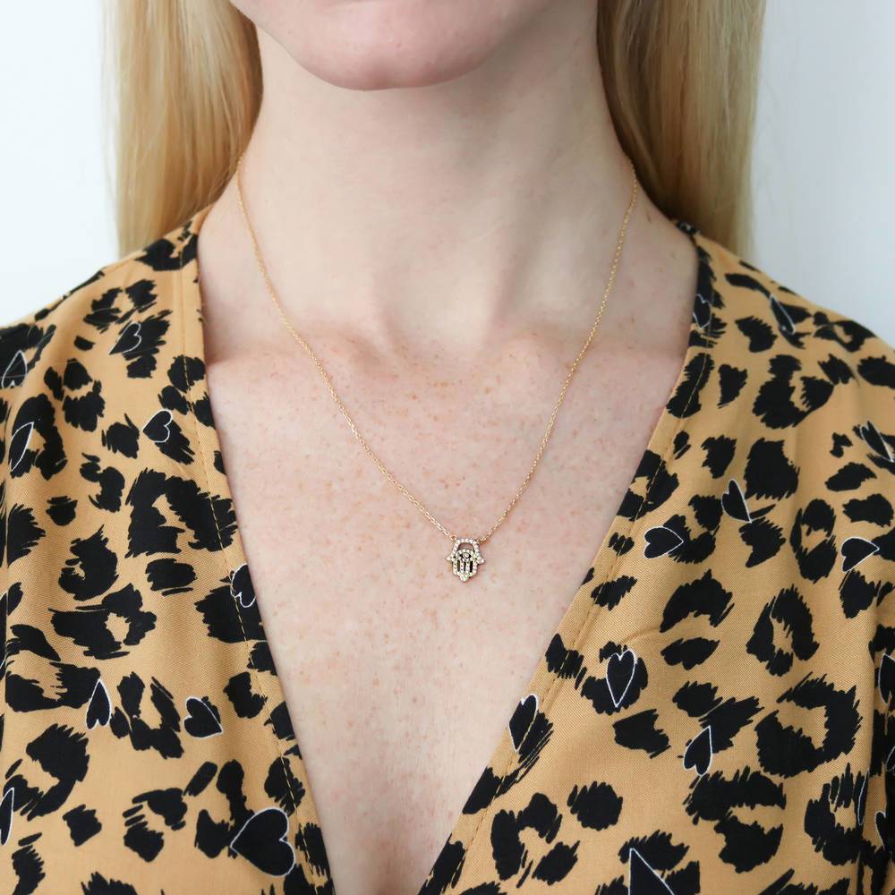 Model wearing Hamsa Hand Evil Eye CZ Necklace in Sterling Silver, 7 of 9