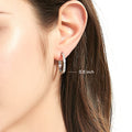 Model wearing Bar CZ Medium Hoop Earrings in Sterling Silver, 0.8 inch