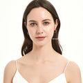 Model wearing Solitaire CZ Small Hoop Earrings in Gold Flashed Sterling Silver, 0.55 inch