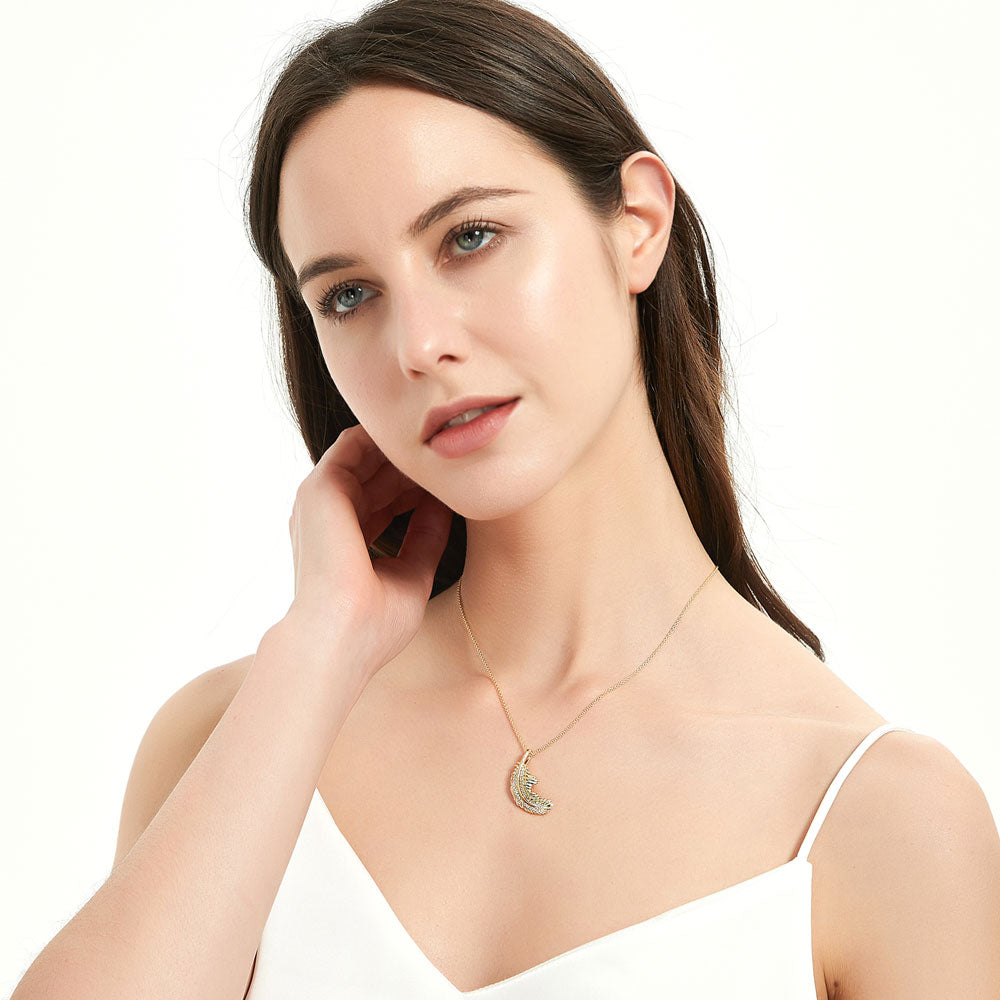 Model wearing Feather CZ Pendant Necklace in Sterling Silver, Yellow Gold Flashed