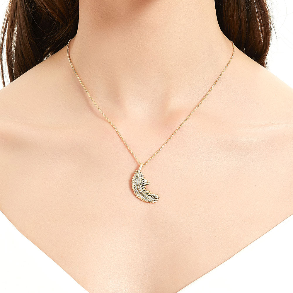 Model wearing Feather CZ Pendant Necklace in Sterling Silver, Yellow Gold Flashed