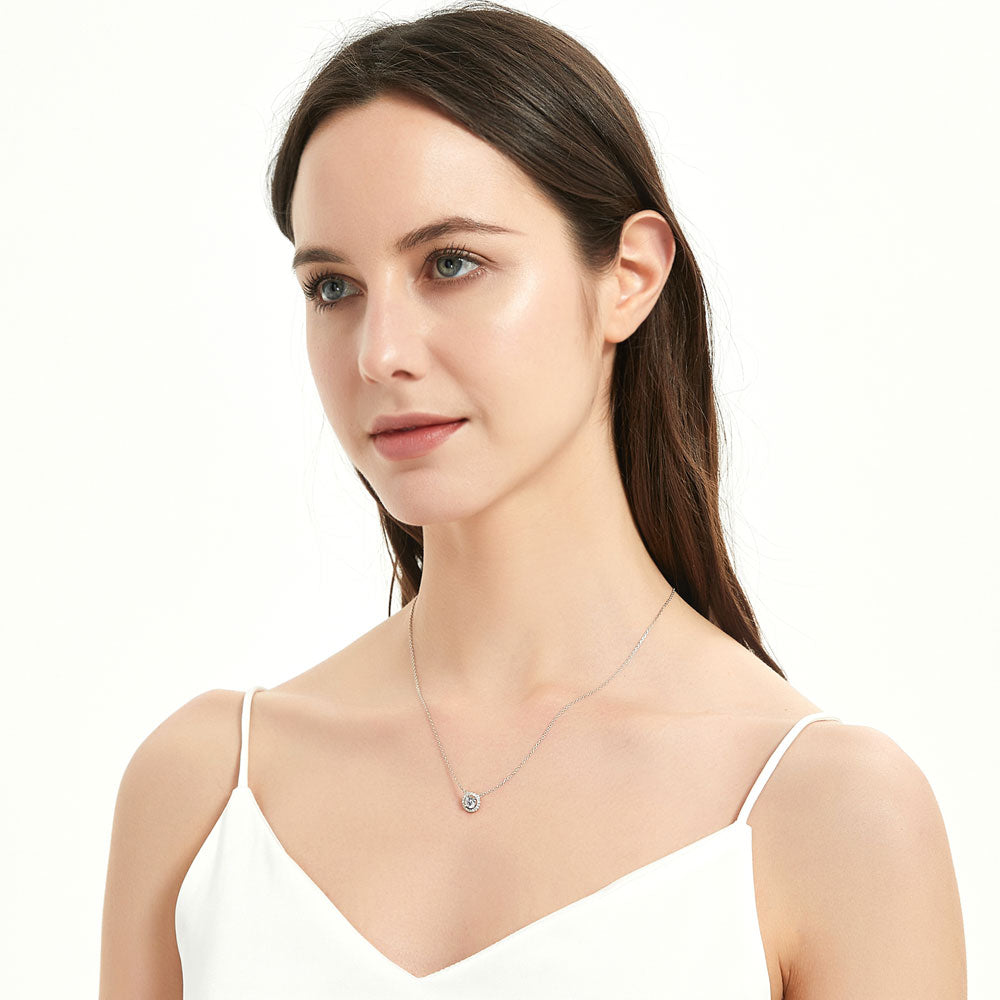 Model wearing Halo CZ Pendant Necklace in Sterling Silver, Yellow Gold Flashed