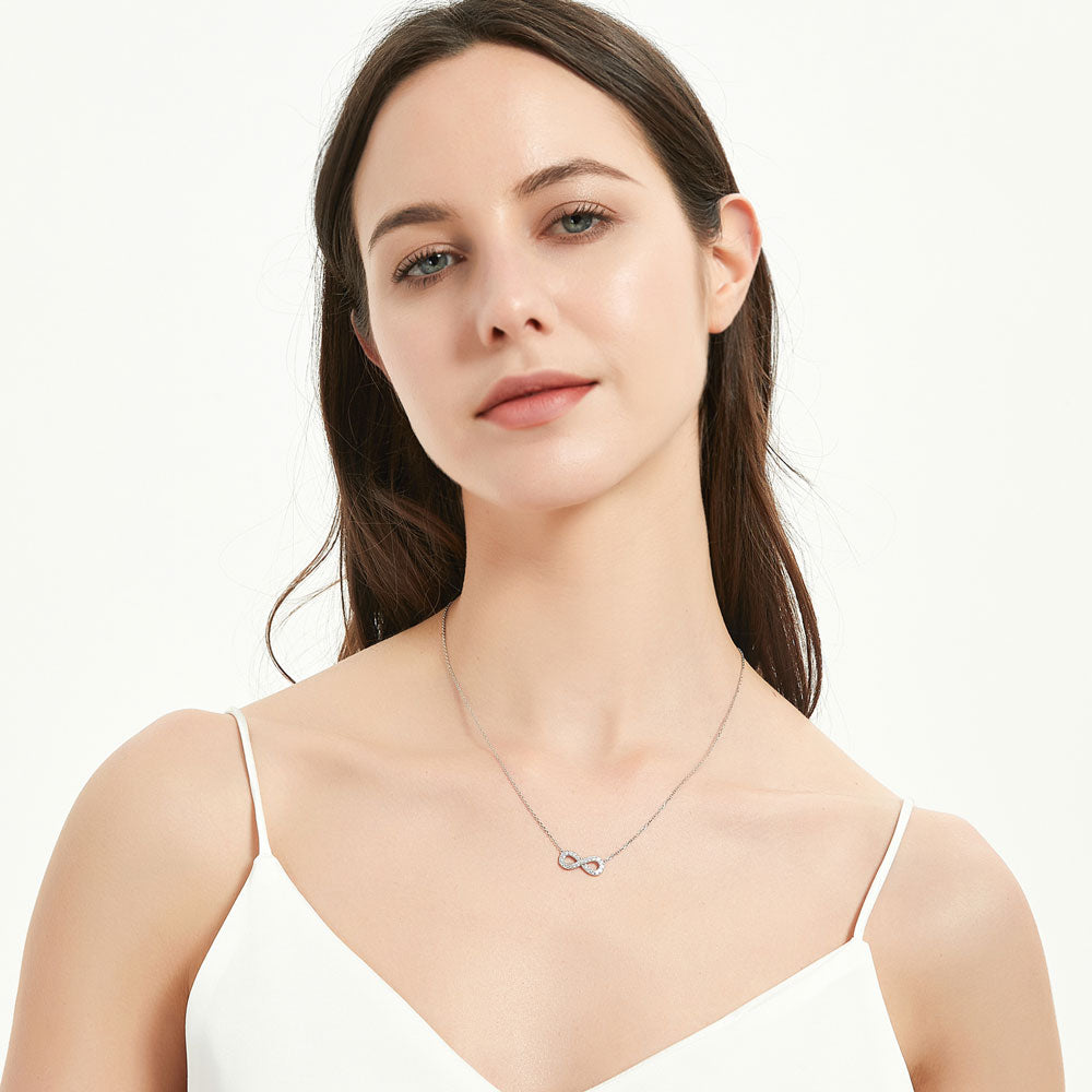 Model wearing Infinity CZ Pendant Necklace in Sterling Silver, Rose Gold Flashed