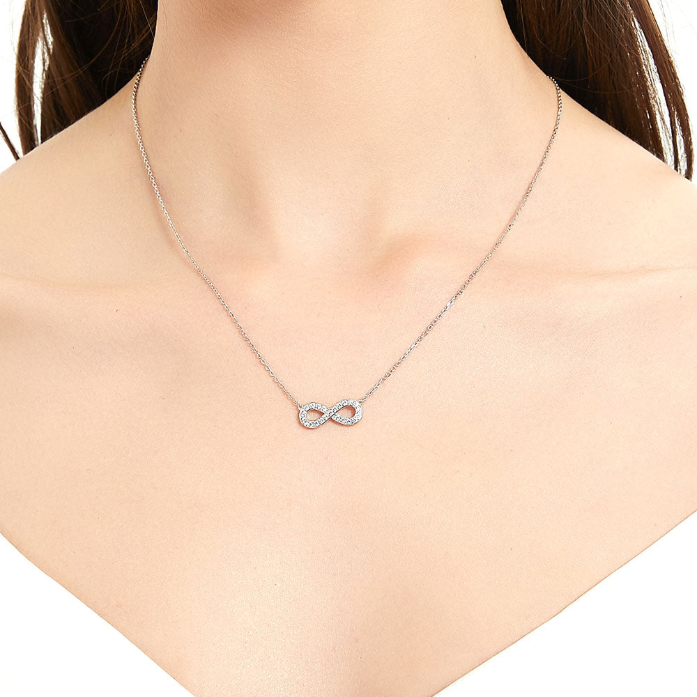 Model wearing Infinity CZ Pendant Necklace in Sterling Silver, Rose Gold Flashed