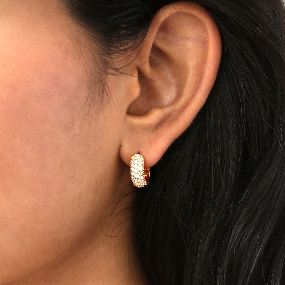 Model wearing Dome CZ Huggie Earrings in Sterling Silver, 2 Pairs, 2 of 13