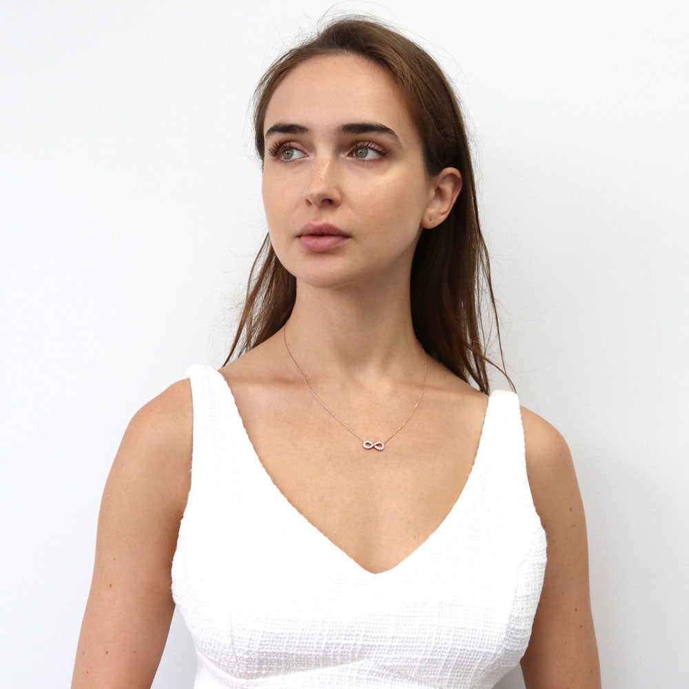 Model wearing Infinity CZ Pendant Necklace in Sterling Silver, Rose Gold Flashed