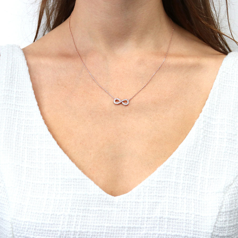 Model wearing Infinity CZ Pendant Necklace in Sterling Silver, Rose Gold Flashed