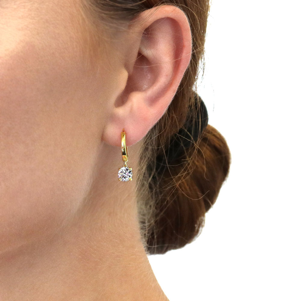 Model wearing Solitaire CZ Huggie Earrings in Sterling Silver 0.5 inch, 2 of 20