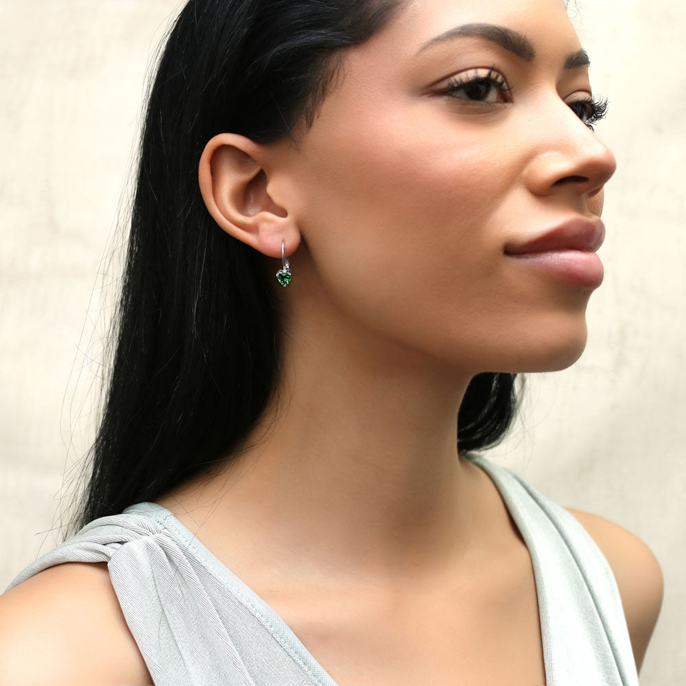 Model wearing Solitaire Heart Heart CZ Leverback Earrings in Sterling Silver, 5 of 7