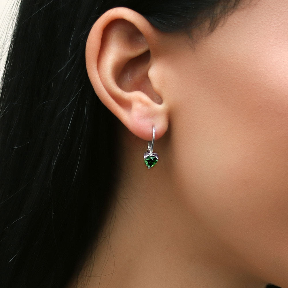 Model wearing Solitaire Heart Heart CZ Leverback Earrings in Sterling Silver, Green Color