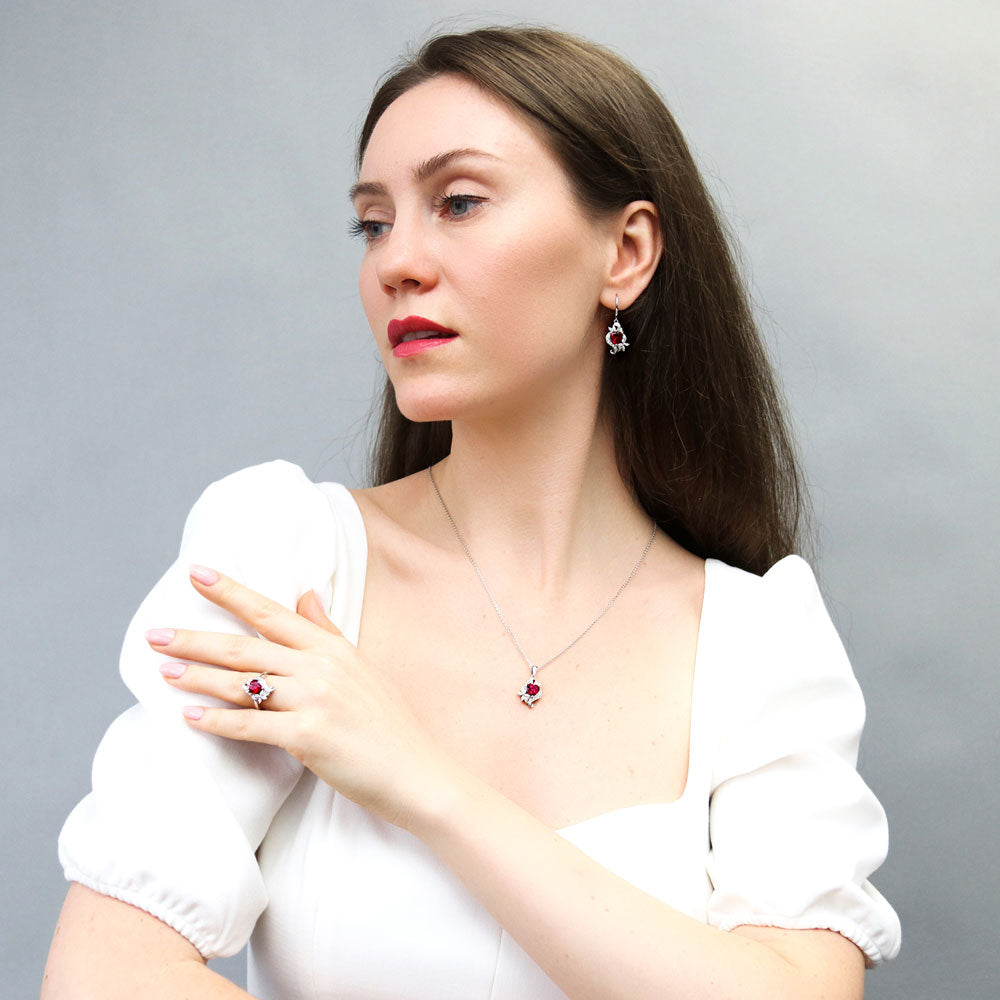 Model wearing Heart Flower CZ Necklace and Earrings in Sterling Silver, 16 of 20