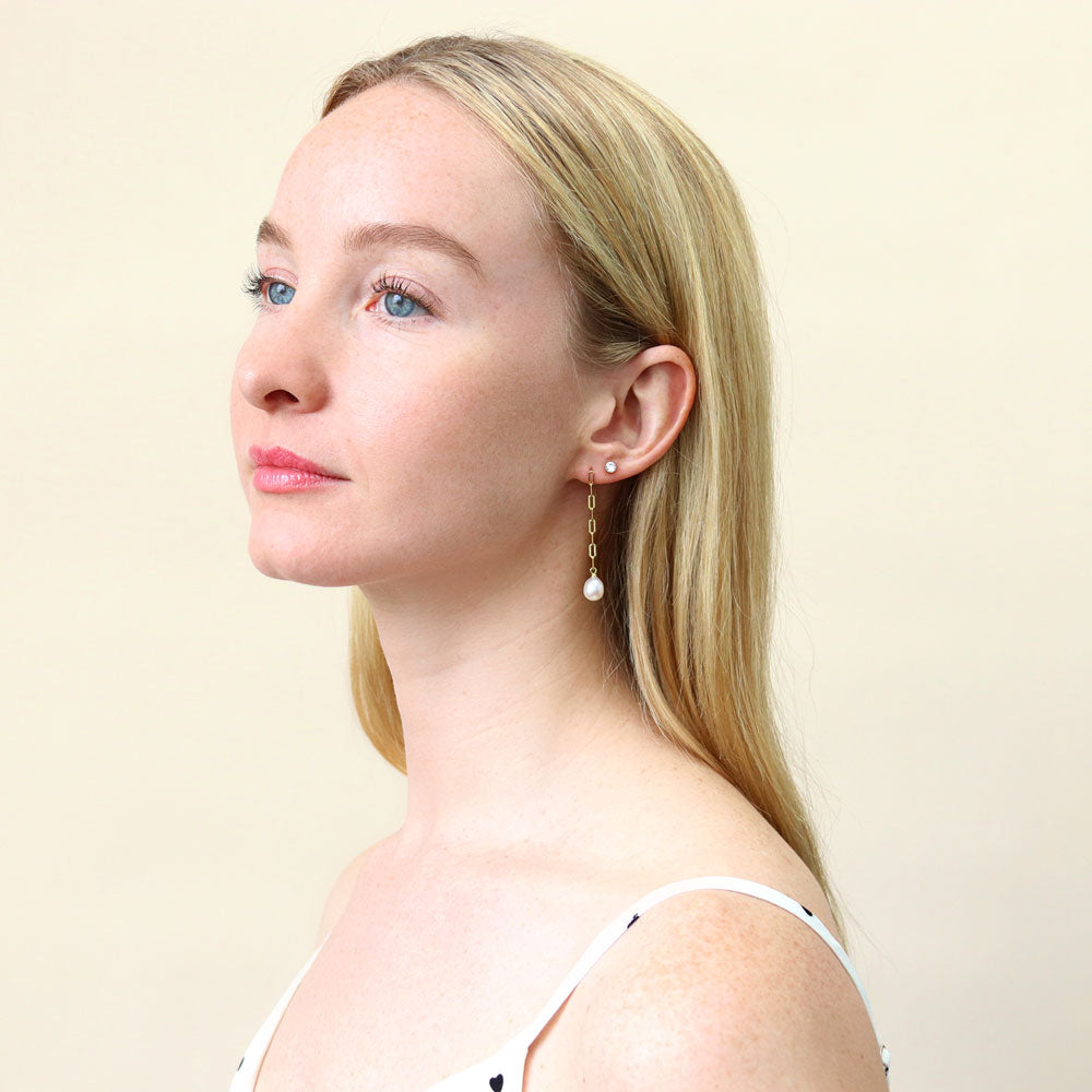 Model wearing Solitaire Oval Cultured Pearl Earrings in Sterling Silver, 7 of 8