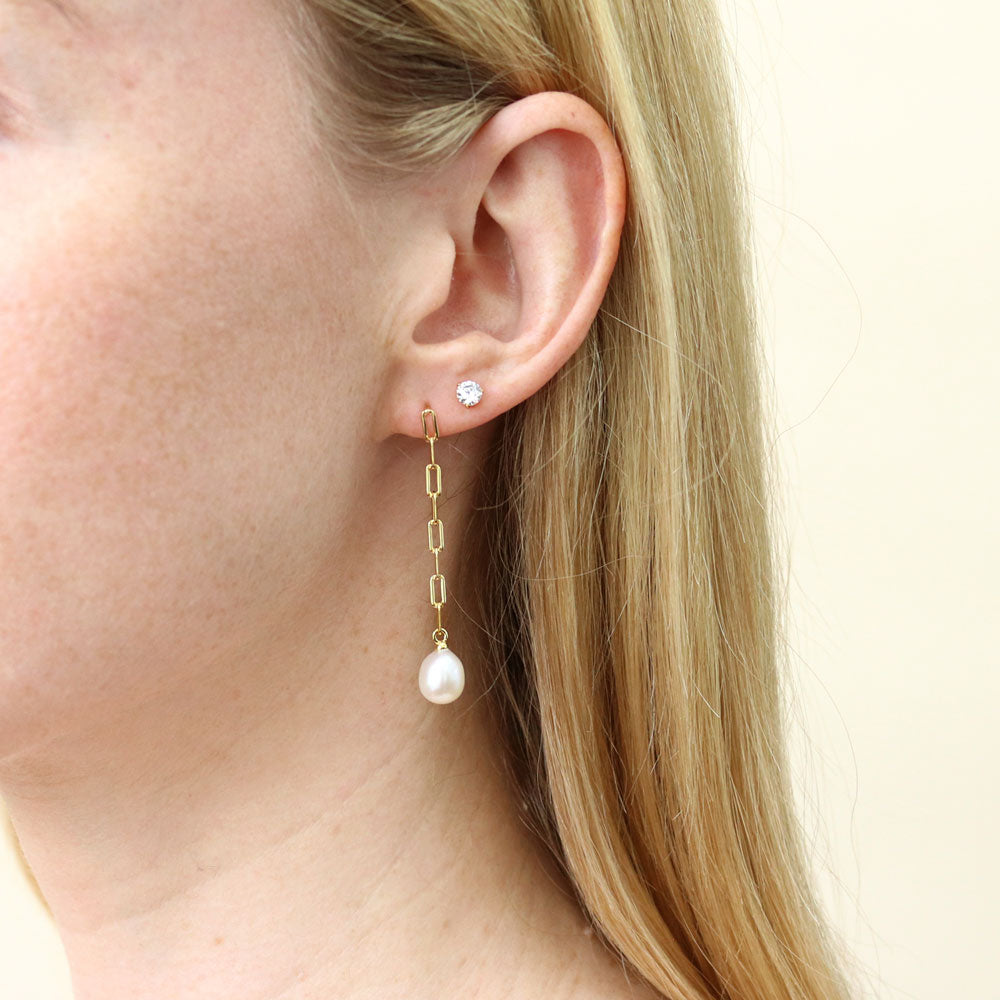 Model wearing Solitaire Oval Cultured Pearl Earrings in Sterling Silver, 6 of 8