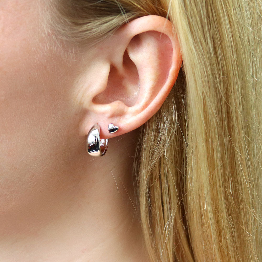 Model wearing Dome Small Huggie Earrings in Sterling Silver 0.55 inch, 14 of 18