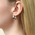 Model wearing Dome Medium Hoop Earrings in Sterling Silver 0.75 inch, Yellow Gold Flashed