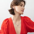 Model wearing Flower Halo CZ Necklace and Earrings in Sterling Silver, Ruby Color